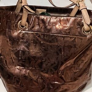 MK bronze purse
